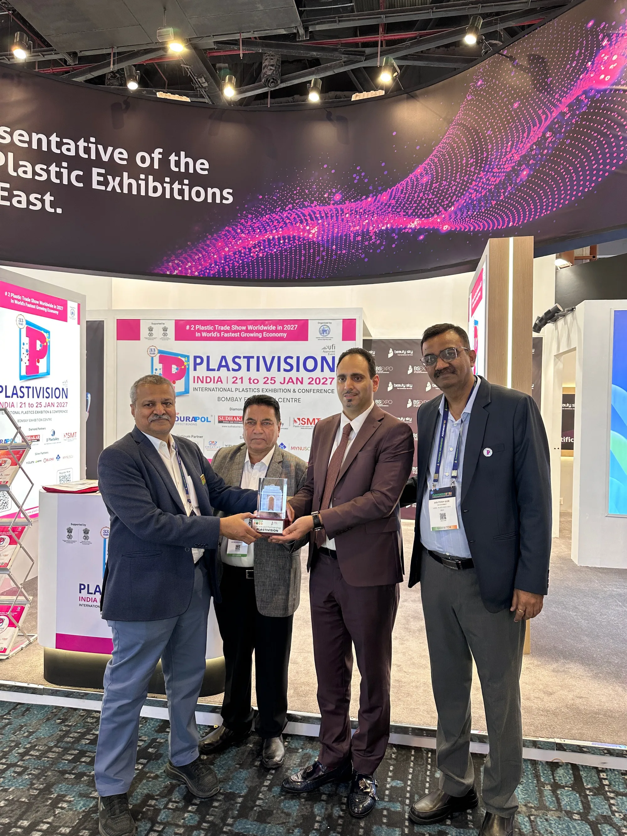 Beauty Sky presenting a partnership trophy to Plastivision organisers at PlastIndia 2026